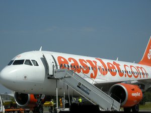 File - An EasyJet flight waits on the runway for passengers to board.