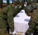 Japan buries its dead as radiation fears grow