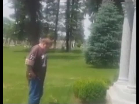 Browns fan urinates on Art Modell's grave