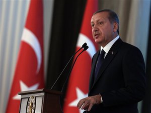 Turkey's new President Recep Tayyip Erdogan speaks during a ceremony where he formally took charge of the presidency from his predecessor, Abdullah Gul, at the Cankaya Palace in Ankara, Turkey, Thursday, Aug. 28, 2014. Erdogan said that as the first president to be elected by the people _ instead of parliament _ his tenure would usher in an era of a “new Turkey, a great Turkey.”