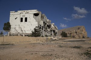 The facade of a hotel bears the signs of fighting in Maaloula, Syria, Thursday, March 3, 2016.