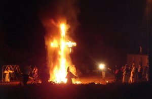 Ku Klux Klansmen and women at a cross lighting in on November 12th, 2005,USA.