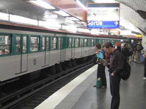 France: Paris Metro train of rubber tyred MP73 stock at Denfert Rocherau station (Line 6 / Ligne 6)