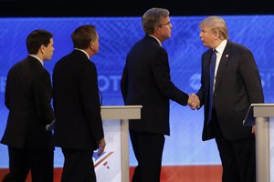 Republican presidential candidate, businessman Donald Trump  shakes hands with Republican presidential candidate, former Florida Gov. Jeb Bush as Republican presidential candidate, Sen. Marco Rubio, R-Fla., and Republican presidential candidate, Ohio Gov. John Kasich  walk past after a Republican presidential primary debate hosted by ABC News at the St. Anselm College  Saturday, Feb. 6, 2016, in Manchester, N.H. (AP Photo/David Goldman)