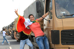 A Kurdish woman from Turkey on a peshmerga military vehicle