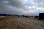 Gypsy peoples in the small camp in Kurdistan, the children playing game and the gypsy's women near the comp, and the children in side the tent door watching the gypsy friends