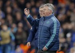 Chelsea manager Guus Hiddink gestures as he watches his team from the touchline during their Champions League round of 16 second leg soccer match between Chelsea and Paris Saint Germain, at Stamford Bridge stadium in London, Wednesday, March, 9, 2016.