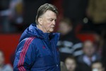 Manchester United's manager Louis van Gaal walks from the pitch after his team's 1-0 loss during the English Premier League soccer match between Manchester United and Southampton at Old Trafford Stadium, Manchester, England, Saturday, Jan. 23, 2016.