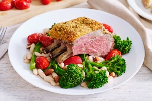 Parmesan-crusted lamb with baby broccoli and white bean salad