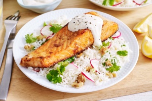 Salmon with yoghurt tahini and walnut rice