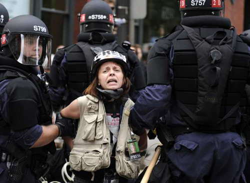 ST. PAUL, MN - SEPTEMBER 2: A woman is taken into custody by police near the Xcel Energy Center, the site of the 2008 Republican National Convention (RNC) September 2, 2008 in St. Paul, Minnesota. The GOP will nominate U.S. Sen. John McCain (R-AZ) as the Republican choice for U.S. President on the last day of the convention. (Photo by Eric Thayer/Getty Images)