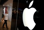 A man walks into one of Apple's authorised premium resellers' outlets on Monday, Nov. 16, 2015, in Singapore.