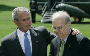 President Bush, left, puts his arm around Karl Rove as they appear before reporters during a news conference on the South Lawn of the White House in Washington, Monday, Aug. 13, 2007, announcing Rove's resignation.