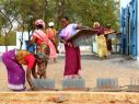 Women in India preparing to dry their farm produce using Sunbest equipment. Photo: Ashden.