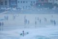 Crowds enjoy Bondi Beach at first light on Friday, during Sydney's long, hot spell.