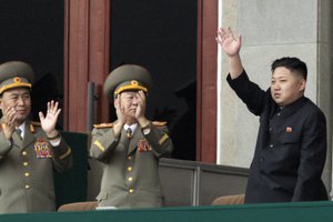 File - North Korean leader Kim Jong Un, left waves as North Korean military officers clap during a mass meeting of North Korea's ruling party at a stadium in Pyongyang, North Korea on Saturday April 14, 2012.