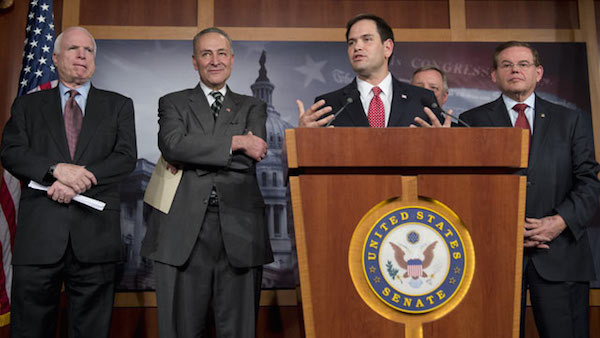 Senator Rubio in a prominent position as the speaker at the podium, providing a Hispanic Republican face to doubling legal immigration and rewarding millions of invasive lawbreakers with amnesty.