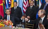 In this Monday, Sept. 28, 2015, photo, provided by the United Nations, US President Barack Obama, left, and Russia's President Vladimir Putin toast during a luncheon hosted during the 70th annual United Nations General Assembly at U.N. headquarters