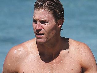 Bondi Vet chris brown goes for a swim in Bondi.