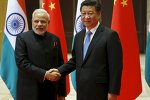 Indian Prime Minister Narendra Modi (L) and Chinese President Xi Jinping shake hands before they hold a meeting in Xian, Shaanxi province, China, May 14, 2015