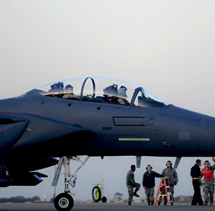 In this image released by the US Air Force (USAF), an F-15E Strike Eagle prepares to depart RAF Lakenheath in the United Kingdom to support Operation Inherent Resolve, on November 12, 2015