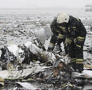 Emergencies Ministry members search the wreckage at the crash site of Flight number FZ981, a Boeing 737-800 operated by Dubai-based budget carrier Flydubai, at the airport of Rostov-On-Don, Russia, March 19, 2016.