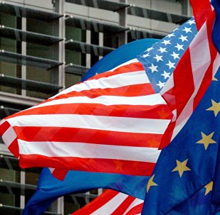 US and European flags float in front of the European Commission headquarters in Brussels 22 February 2005