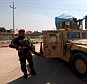 Iraqi army members stand guard at the entrance to the Nineveh Liberation Operations Command at Makhmour base, south of Mosul, Iraq, March 13, 2016.  REUTERS/Azad Lashkari - RTSAHR2