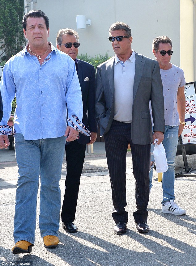 Mates: His entourage included the actor, celebrity bodyguard and amateur boxer Chuck Zito, pictured at left