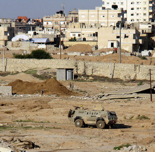 Egyptian army armored vehicle stands on the on the Egyptian side of border town of Rafah, north Sinai, Egypt