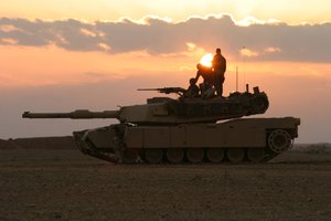 Marines provide security while other Marines use bulldozers to build a barrier berm along the Iraqi-Syrian border south of Husaybuh, Iraq.