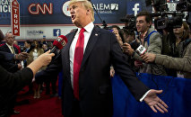 Republican presidential candidate businessman Donald Trump speaks with the media in the Spin Room following the Republican Presidential Debate, hosted by CNN, at The Venetian Las Vegas on December 15, 2015 in Las Vegas, Nevada