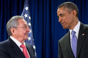 President Barack Obama talks with Cuban President Raul Castro 