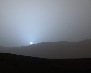 File - NASA's Curiosity Mars rover recorded this view of the sun setting at the close of the mission's 956th Martian day, or sol (April 15, 2015), from the rover's location in Gale Crater.