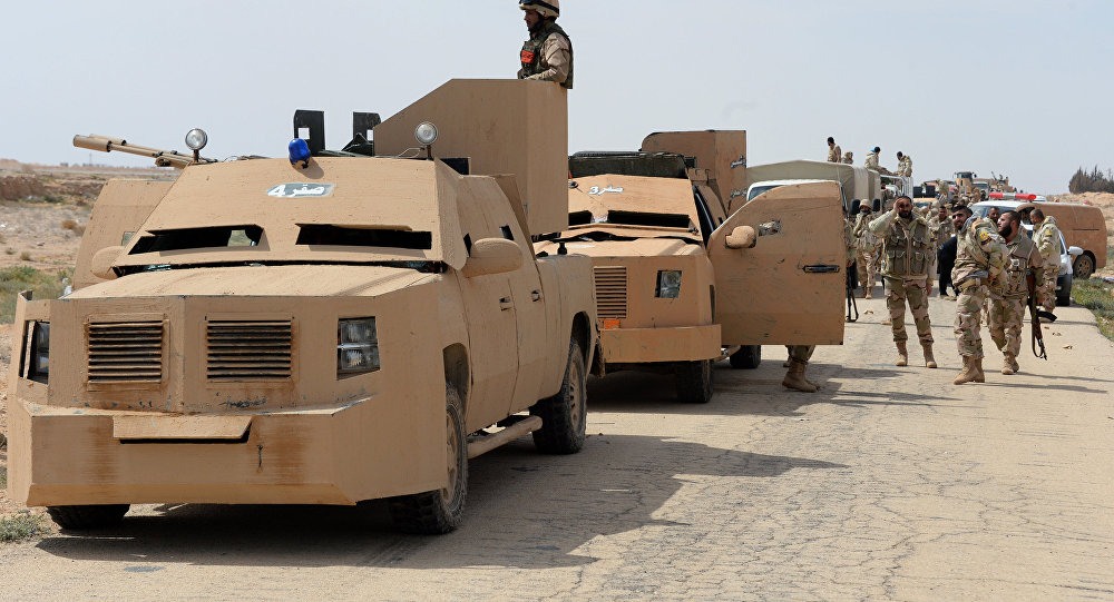 The Desert Falcons self-defense unit re-deploy outside Palmyra, Syria.