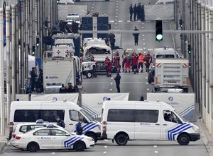 Police and rescue teams are pictured outside the metro station Maelbeek in Brussels, Tuesday, March 22, 2016.