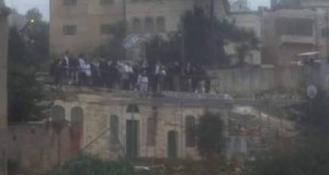 Settlers on the roof of the Shamsiyyeh family home
Photo credit: Imad Abu Shamsiyyeh