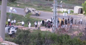 Settlers gathering  on the Jabari family land with police protection