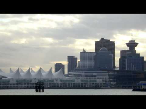 Medium shot of Vancouver skyline from across harbor