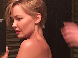 Lara Bingle goes topless in Venice