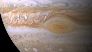 File - Trapped between two jet streams, the Great Red Spot on Jupiter is an anticyclone swirling around a center of high atmospheric pressure that makes it rotate in the opposite sense of hurricanes on Earth.