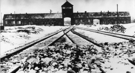 ** FILE ** In this Jan. 1941 file picture, the entry to the concentration camp of Auschwitz-Birkenau, Poland, with snow covered railtracks leading to the camp is shown. Architectural plans for the Nazi death camp Auschwitz that were discovered in Berlin last year go on public display in the German capital on Tuesday Feb. 17, 2009. (AP Photo)