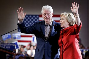 Democratic presidential candidate Hillary Clinton, right, waves on stage with her husband and former President Bill Clinton for a Nevada Democratic caucus rally, Saturday, Feb. 20, 2016, in Las Vegas.