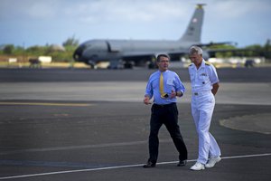 Deputy Defense Secretary Ashton B. Carter, left, speaks with Navy Adm. Samuel J. Locklear III, commander of U.S. Pacific Command, upon his arrival on Joint Base Pearl Harbor-Hickam, Hawaii, July 17, 2012.