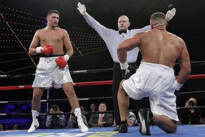 The referee stops the fight between Hughie Fury, left, and Alex Rozman in a heavyweight boxing match, Saturday, April 20, 2013 at the Theatre at Madison Square Garden in New York. Fury won by TKO in the first round.