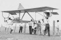 Members of the NSW Gliding Club lifting a glider over a wire fence, Box Hill, NSW, 24 August 1930. 