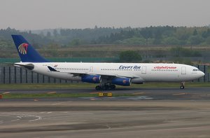 File - An EgyptAir Airbus A340 sits on the tarmac at an airport.