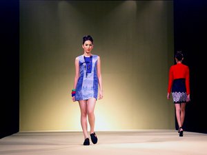 Shades of blue fitted dress is worn by a model on the catwalk as part of the Ceige Cagalawan Collection at the Philippine Fashion Week held at SMX, Manila as seen in this May 29, 2009 photo.