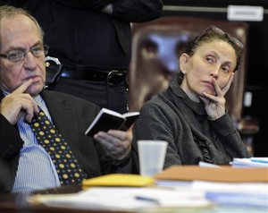 Gigi Jordan, right, appears in Manhattan Supreme Court with her attorney Alan Dershowitz, Friday, Dec. 23, 2011, in New York.