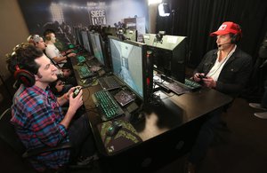 IMAGE DISTRIBUTED FOR UBISOFT - Ben Schwartz and Will Arnett play Rainbow Six Siege for charity at Ubisoft’s “Siege Day” competition event in Los Angeles on Monday, Nov. 23, 2015.